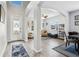 Inviting foyer with high ceilings, elegant arches, and views into the formal living and dining spaces at 3046 Donington Castle Ln, Land O Lakes, FL 34638