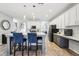 Open-concept kitchen with an island bar, and modern countertops and appliances at 3046 Donington Castle Ln, Land O Lakes, FL 34638