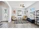 Inviting living room with neutral decor, modern furnishings, large windows, and stylish flooring, creating a cozy atmosphere at 3046 Donington Castle Ln, Land O Lakes, FL 34638