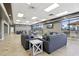 Comfortable lounge area with plush seating, tables, and a view of the surroundings at 3046 Donington Castle Ln, Land O Lakes, FL 34638