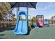 Playground featuring a blue slide, train and other activities for hours of fun at 3046 Donington Castle Ln, Land O Lakes, FL 34638