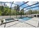 Relaxing screened-in pool with a spa and comfortable seating for outdoor enjoyment and entertainment at 3046 Donington Castle Ln, Land O Lakes, FL 34638
