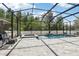 Relaxing screened-in pool with a spa and comfortable seating for outdoor enjoyment and entertainment at 3046 Donington Castle Ln, Land O Lakes, FL 34638