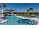 Enjoy the beautiful lazy river, a community amenity featuring ample seating, sun and shade at 31350 Pendleton Landing Cir, Wesley Chapel, FL 33545