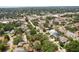 This home features an aerial view of a residential neighborhood with tree-lined streets and community amenities nearby at 3603 E Sterling Cir, Tampa, FL 33629