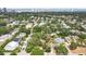 This home features an aerial view of a tranquil neighborhood with mature trees and proximity to the bay and city skyline at 3603 E Sterling Cir, Tampa, FL 33629