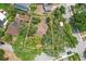Aerial view of a property with a treed lot and a yellow border around the perimeter at 3603 E Sterling Cir, Tampa, FL 33629