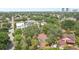 An aerial shot shows lush, established neighborhood featuring mature trees and a mix of charming residential homes at 3603 E Sterling Cir, Tampa, FL 33629