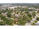 Aerial view of home surrounded by mature trees, in a neighborhood close to shopping at 3603 E Sterling Cir, Tampa, FL 33629