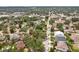 This home features an aerial view of a residential neighborhood with tree-lined streets and well-maintained properties at 3603 E Sterling Cir, Tampa, FL 33629