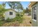 Backyard with a small shed, showcasing the outdoor space and storage options at 3603 E Sterling Cir, Tampa, FL 33629