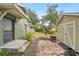 Fenced yard with shed, hardscaped patio and walkway at 3603 E Sterling Cir, Tampa, FL 33629