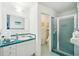 Bathroom featuring teal tiled counters, floors, and walk in shower at 3603 E Sterling Cir, Tampa, FL 33629