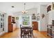 Well-lit dining room featuring a table, chairs, and a large window with natural light at 3603 E Sterling Cir, Tampa, FL 33629
