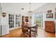 Bright dining room featuring hardwood floors, natural light and ample space at 3603 E Sterling Cir, Tampa, FL 33629