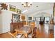 Dining room with hardwood floors and view to kitchen and living room at 3603 E Sterling Cir, Tampa, FL 33629