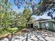 Charming one-story home with mature trees and a paved driveway at 3603 E Sterling Cir, Tampa, FL 33629
