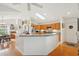 Bright kitchen with a breakfast bar, wooden cabinets, stainless steel refrigerator, and a skylight at 3603 E Sterling Cir, Tampa, FL 33629