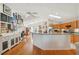 Open-concept kitchen with wood floors, skylight, and a breakfast bar, perfect for modern living at 3603 E Sterling Cir, Tampa, FL 33629