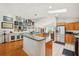 View of the open layout kitchen featuring stainless steel appliances and adjacent dining area at 3603 E Sterling Cir, Tampa, FL 33629