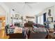 Inviting living room with fireplace, ceiling fan, and comfortable leather seating arrangement at 3603 E Sterling Cir, Tampa, FL 33629