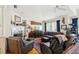Comfortable living room with a fireplace, hardwood floors and natural light at 3603 E Sterling Cir, Tampa, FL 33629