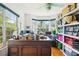 Sun-lit home office with hardwood floors and storage at 3603 E Sterling Cir, Tampa, FL 33629