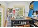 Small storage room features a utility sink and lots of items in front of a window at 3603 E Sterling Cir, Tampa, FL 33629