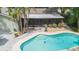 Aerial view showcasing the pool and spacious outdoor entertaining area at 3714 Village Estates Pl, Tampa, FL 33618