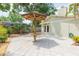 Spacious backyard featuring a poolside eating space, tropical plants and lush lawn at 3714 Village Estates Pl, Tampa, FL 33618