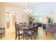 Elegant dining area with wood floors and a view of the living room and kitchen at 3714 Village Estates Pl, Tampa, FL 33618