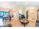 Open-concept floor plan with hardwood floors, a dining area, and a cozy living space at 3714 Village Estates Pl, Tampa, FL 33618
