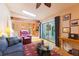 Living room with a fireplace and glass doors with backyard views at 3714 Village Estates Pl, Tampa, FL 33618