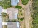 Aerial view of the home showing its layout on the lot, its roof, and proximity to neighboring properties at 3932 Watson Dr, New Port Richey, FL 34655