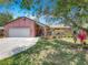 Charming single-story home with well-maintained landscaping and a two-car garage at 3932 Watson Dr, New Port Richey, FL 34655