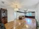 Spacious living room with hardwood floors, built-in shelving, and natural light at 3932 Watson Dr, New Port Richey, FL 34655