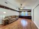 Comfortable living room features hardwood floors and a built-in bookcase at 3932 Watson Dr, New Port Richey, FL 34655