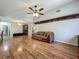 Spacious living room with hardwood floors and a ceiling fan at 3932 Watson Dr, New Port Richey, FL 34655