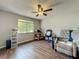 Office space filled with chair, desk, shelving and a light-filled window at 3932 Watson Dr, New Port Richey, FL 34655