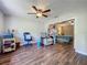 Inviting office area with a ceiling fan and an open view to the bedroom at 3932 Watson Dr, New Port Richey, FL 34655