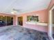 Enclosed patio with tile floors, ceiling fan and sliding doors at 3932 Watson Dr, New Port Richey, FL 34655