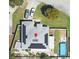 This aerial view showcases a property with solar panels and a refreshing blue swimming pool at 404 Oakmount Rd, Clearwater, FL 33765