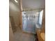 Updated bathroom featuring a tiled stand up shower with glass door at 404 Oakmount Rd, Clearwater, FL 33765