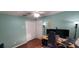 Bright bedroom with hardwood floors, white trim and doors, and a ceiling fan at 404 Oakmount Rd, Clearwater, FL 33765