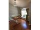 Cozy dining area with hardwood floors and a table with a decorative checkerboard pattern at 404 Oakmount Rd, Clearwater, FL 33765