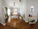 Bright dining area with hardwood floors, complemented by stylish décor and lots of sunlight at 404 Oakmount Rd, Clearwater, FL 33765