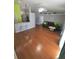 Spacious living room with hardwood floors, fan, and a comfortable seating area perfect for relaxation at 404 Oakmount Rd, Clearwater, FL 33765