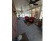 Enclosed sunroom featuring tiled flooring, ceiling fans, and ample natural light at 404 Oakmount Rd, Clearwater, FL 33765