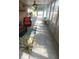 Cozy sunroom with bright windows, tile floors and decorative rug for relaxation at 404 Oakmount Rd, Clearwater, FL 33765