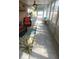 Enclosed sunroom with neutral tile flooring, ceiling fans, bright windows, and comfortable seating at 404 Oakmount Rd, Clearwater, FL 33765